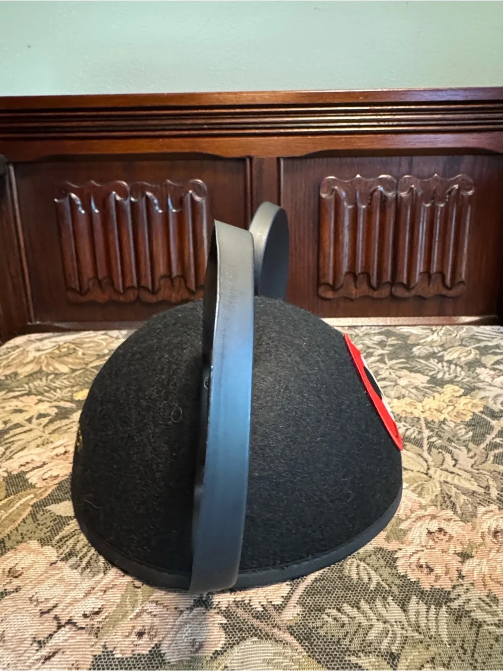 Disney black Mickey Mouse ears hat with red patch.